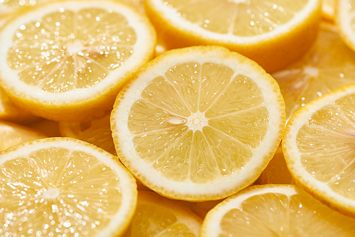 close up view of ripe fresh yellow lemon slices