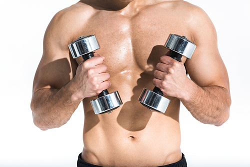 cropped view of shirtless man with muscular torso holding dumbbells on white background