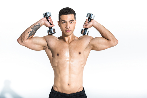 handsome mixed race athletic man with muscular torso holding dumbbells on white