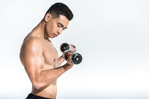 handsome athletic mixed race man training with dumbbells on white