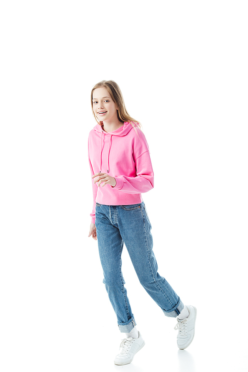 happy teenage girl in blue jeans and pink hoodie isolated on white