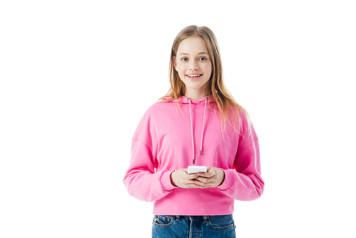 happy teenage girl in pink hoodie holding smartphone isolated on white