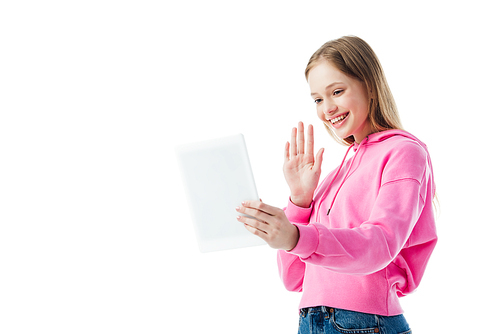 low angle view of smiling teenage girl having video chat on digital tablet and waving hand isolated on white