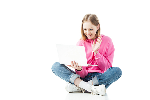 happy smiling teenage girl waving hand in laptop screen during video chat isolated on white, illustrative