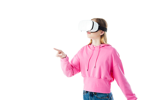 teenage girl in pink hoodie wearing vr headset and pointing with finger isolated on white