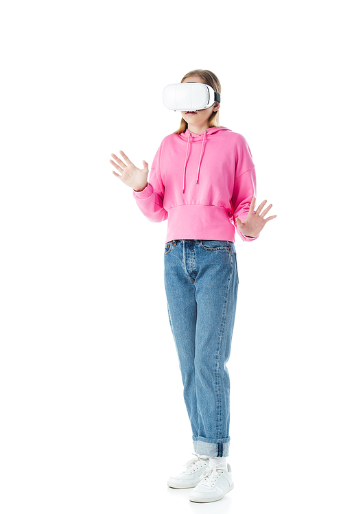 teenage girl in pink hoodie and jeans wearing vr headset and gesturing isolated on white