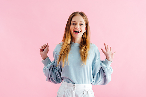 happy pretty teenage girl  isolated on pink