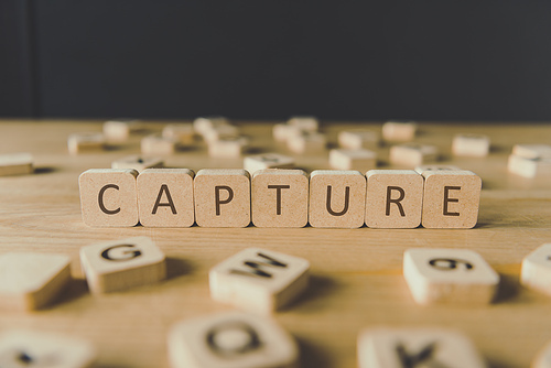 selective-focus-of-word-capture-made-of-cubes-surrounded-by