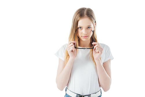 cheerful teenage girl holding glasses and  isolated on white