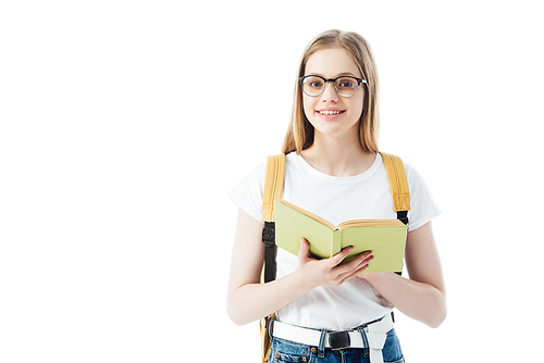 smiling schoolgirl with backpack holding book isolated on white