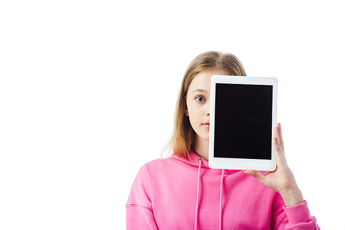 teenage girl holding digital tablet with blank screen in front of face isolated on white