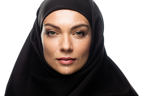 young Muslim woman in hijab having marks on face for plastic surgery isolated on white