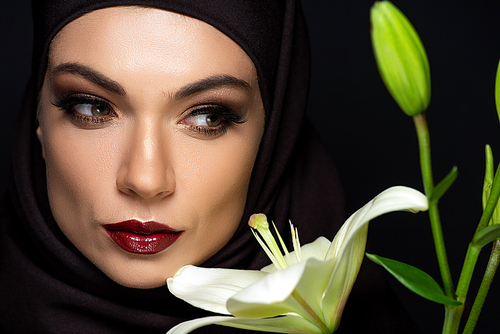 유토이미지 | attractive Muslim woman in hijab with red lips near lily ...