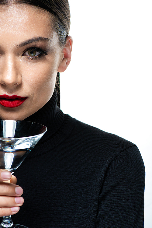 cropped view of beautiful elegant woman with red lips holding martini glass isolated on white