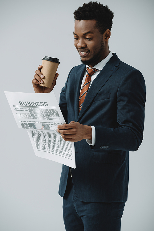 유토이미지 Cheerful African American Man Reading Business Newspaper And