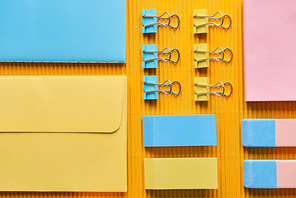 top view of colorful office stationery supplies on yellow