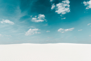 beautiful clean beach with white sand and blue sky with white clouds