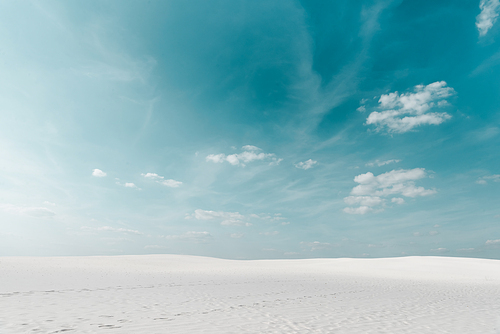 beautiful beach with white sand and blue sky with white clouds