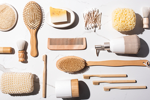 Top view of different hygiene and beauty items on white background, zero waste concept
