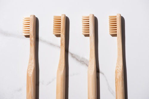 Top view of toothbrushes on white background, zero waste concept