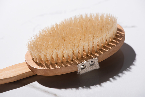 Wooden hair brush on white background, zero waste concept