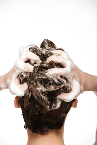 back view of woman washing hair with shampoo isolated on white