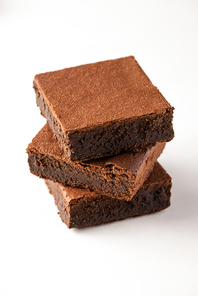 delicious brownie pieces on white background