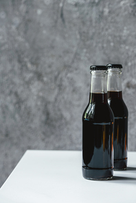 cold brew coffee in bottles on white table