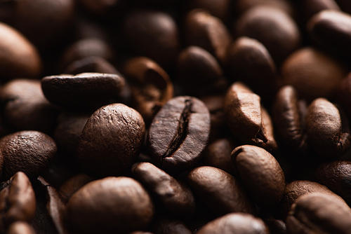 close up view of fresh roasted coffee beans background