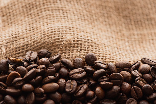 close up view of fresh roasted coffee beans in sack