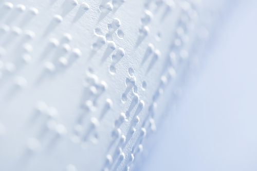 selective focus of braille text on white paper with copy space
