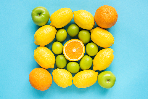 top view of fresh fruits on blue background