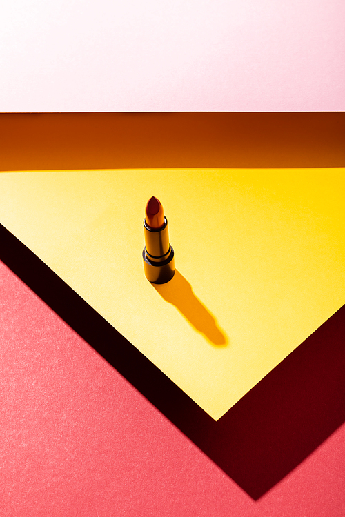 shadow near lipstick on yellow, pink and crimson