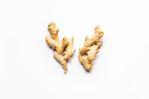 top view of ginger roots on white background