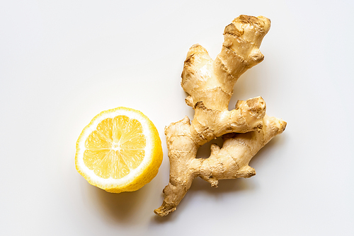top view of ginger root, lemon on white background