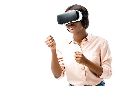 african american woman in shirt with virtual reality headset showing fists isolated on white