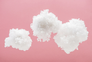 white fluffy clouds made of cotton wool isolated on pink