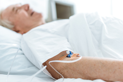 selective focus of senior patient in coma in hospital