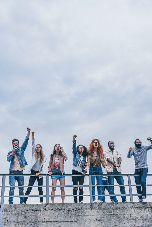 multicultural men and women gesturing and screaming outside