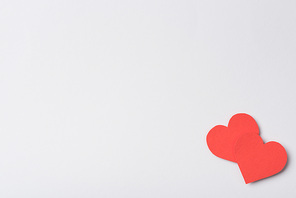 top view of red hearts on white background