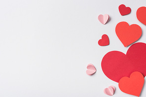 top view of red hearts on white background