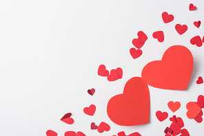 top view of red hearts on white background