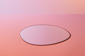 round fragile mirror on pink background with copy space