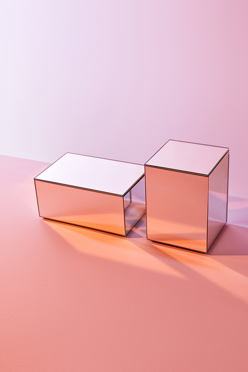 cubes with light reflection on surface on pink background