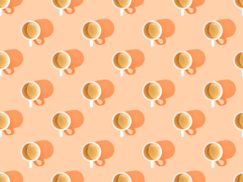 top view of cups of fresh coffee on orange, seamless background pattern