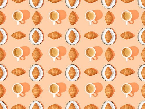 top view of fresh croissants on plates and coffee on orange, seamless background pattern