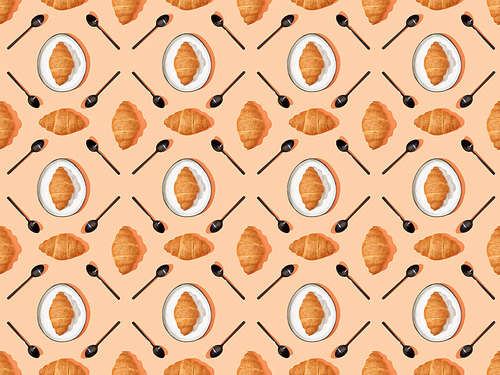top view of spoons and fresh croissants on plates on orange, seamless background pattern
