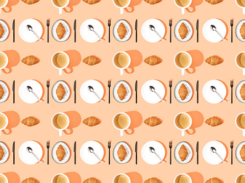 top view of cutlery, fresh croissants on plates and coffee on orange, seamless background pattern