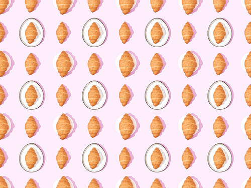 top view of croissants on plates on pink, seamless background pattern