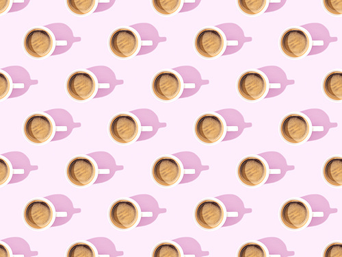 top view of cups of fresh coffee on violet, seamless background pattern